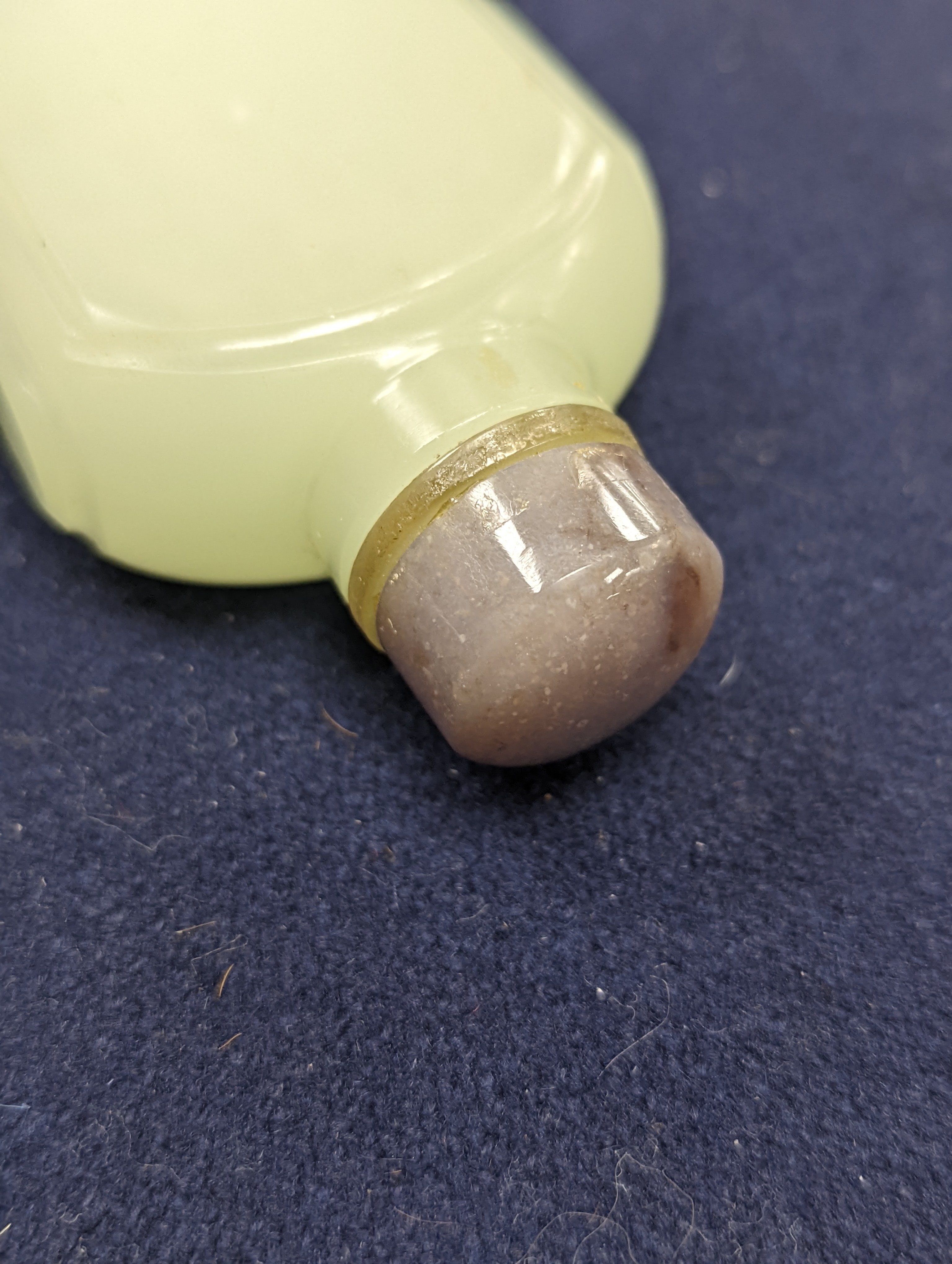 A Chinese jade belt hook, 12.5cm an archer's ring and figure, a stone cup and a glass snuff bottle